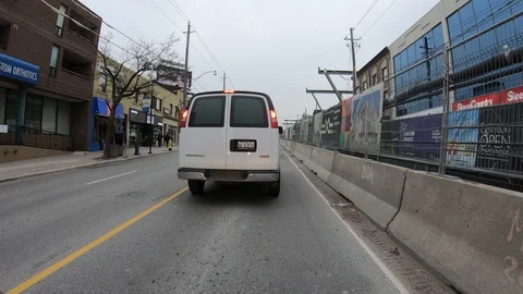 POV driving through road construction on city streets Stock Footage 98443423