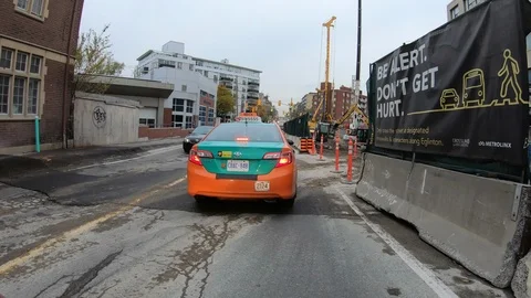 POV driving through road construction on city streets Stock Footage 98444457