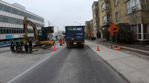 POV driving through road construction on city streets Stock Footage 98444908