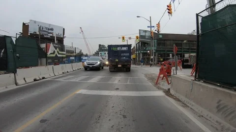 POV driving through road construction on city streets Stock Footage 98445065