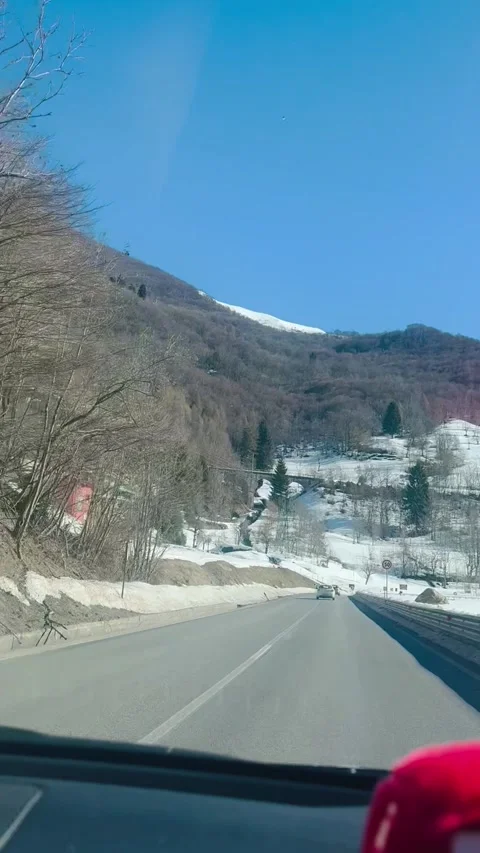 POV Driving Through Snowy Alpine Mountain Road in Italy. Stock Footage 330229496