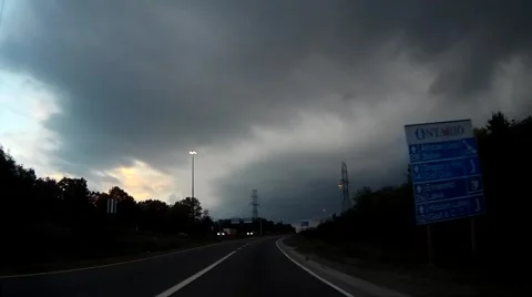 POV driving towards storm with tornado warning in effect Stock Footage 67340774