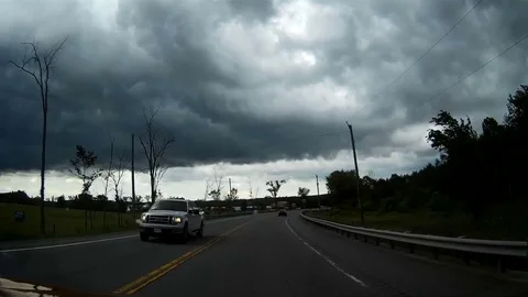 POV driving under dark clouds into storm Stock Footage 76820591