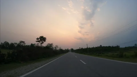 POV driving view of a two lane highway in Udalguri Assam Stock Footage 339269247