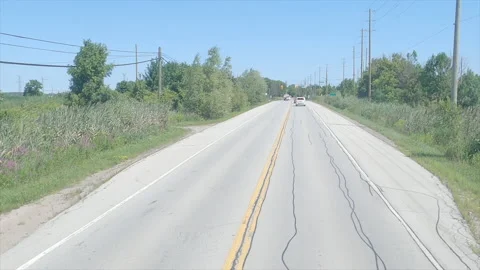 POV driving on wide open road empty highway with traffic and blue sky Stock Footage 159124553