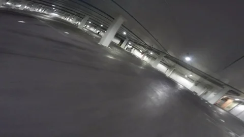 POV of a drone competition taking place in a parking lot Stock Footage 99050494