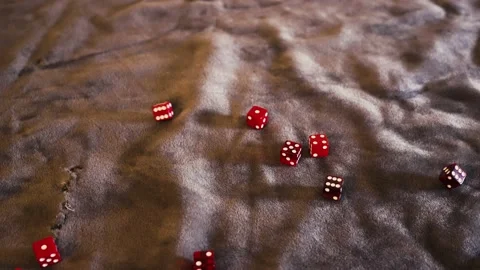 POV. Dropping various red dice, smoky, clear, and solid, into frame. Stock Footage 171174216