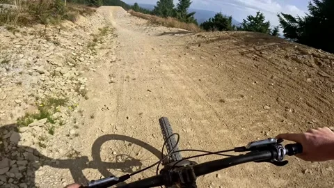 POV: Dynamic first-person ride on a gravel surface with sharp turns. Capturing Stock-Footage 317710145