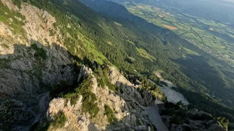 POV Dynamic FPV Dive Down Sunny Mountain Slope, 4K Stock Footage 321200366