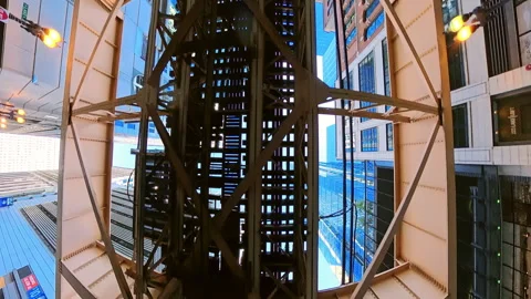 POV of Dynamic upward looking view beneath the iconic Chicago elevated train CTA Stock Footage 321116373