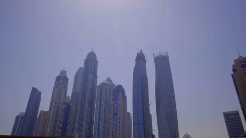 P.O.V. elevated driving view of downtown with blue sky Dubai Stock Footage 104156940