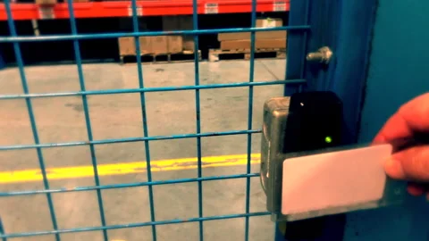 POV of Employee using Security Keycard To Enter Warehouse Slow Motion Stock Footage 261328419