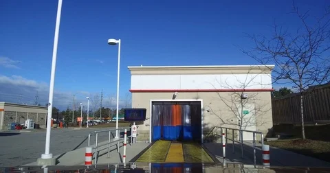 POV entering and going through an automatic car wash Stock Footage 72926456