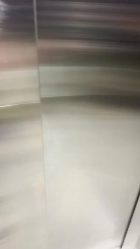 POV entering elevator or lift and clicking on button to go up. Person going to Stock Footage 345369956