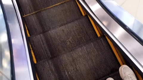 POV escalator at the mall. Escalator steps, stairs, upward movement Video stock 310312830