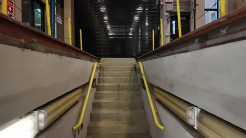 POV exiting train inspection pit in streetcar maintenance bay 库存影片 341321686