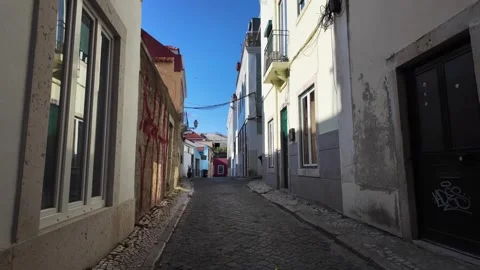 POV Exploring Portuguese Capital Streets With Tourists Locals and Historic Build Video stock 341982917