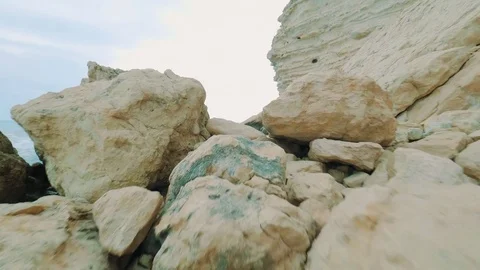 POV Extreme path through the rocks to the beautiful blue sea. Beautiful seascape Stock Footage 76631660