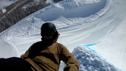 POV extreme skier doing backflip off jump on sunny day Stock Footage 105022908
