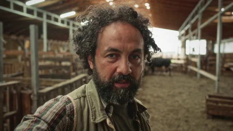 POV of Farmer Talking on Camera as Filming Video Vlog inside Barn Video stock 342035183
