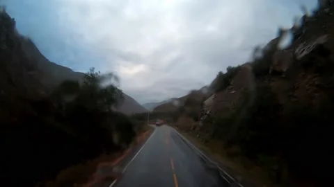 POV fast camera of a bus trip on the road while the rain wets the windshield and 스톡 동영상 164440606