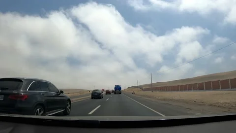 Pov fast camera driving down the road next to some cyclists in the day in point Stock Footage 197083175