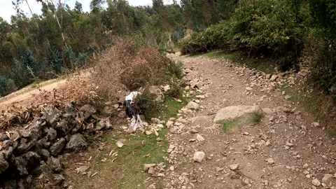 Pov fast camera of a first person view going down a dangerous road full of rocks Stock Footage 164622542