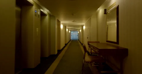 POV Fast Run Through Long Old Hotel Corridor to Sunlit Elevator Video stock 316059934