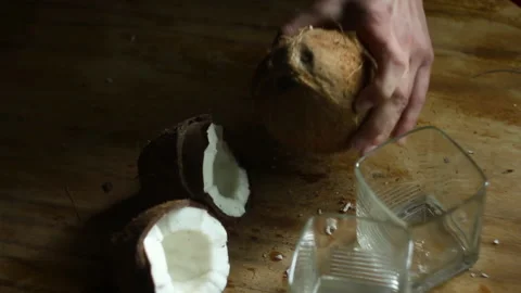 POV female hands using knife to open coconut for drinking coconut water. Health 스톡 동영상 131272765