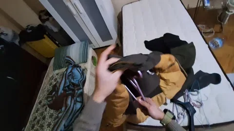 POV First Person Hanging Jacket on Clothes Hanger at Home Stock Footage 330100234