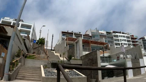 POV first person view going up the stairs to a beach house and in the background Stock Footage 195128506