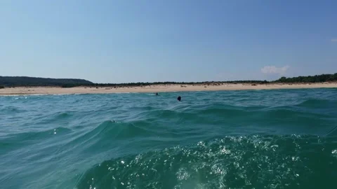 POV First Person View Hands Swimmer Floating in Blue Ocean Water near Beach Stock Footage 344549470