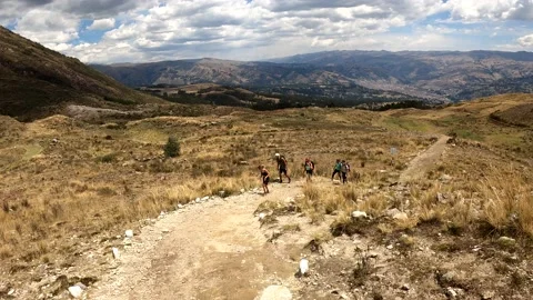 Pov first person view looking at tourists climbing a mountain trek in the Stock Footage 164607442
