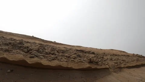 POV first person view looking at a scary hill and cliff with many stones about Stock Footage 195126975