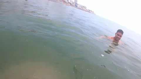 POV first person view managing to stand on a large rock in the sea underwater 库存影片 195128097