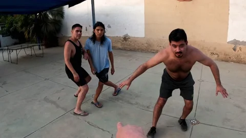 POV first person view playing basketball with friends and scoring in a country Stock Footage 170024647