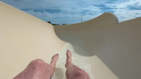 POV First person view riding a water slide at an outdoor water park with Video stock 337984037