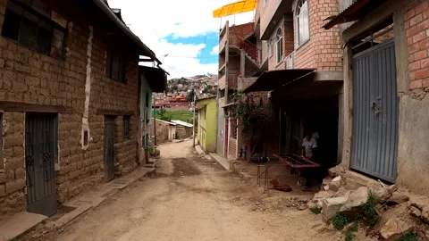 Pov first person view running through dirt streets in Huaras far from the city 動画素材 164585235