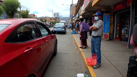 Pov first person view running on the streets of Huaraz between people and cars Vídeos de archivo 164586476