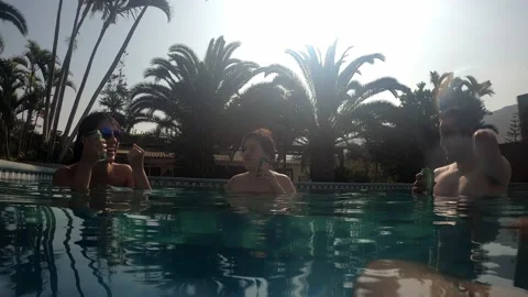 POV first person view talking with friends inside a swimming pool having beers Stock Footage 170024364