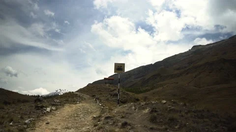 Pov first person view walking on a trekking path looking at a sign of Radian Stock Footage 164596885
