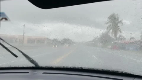 POV: First person view of windshield wipers cleaning the glass during rainstorm Stock Footage 197990568