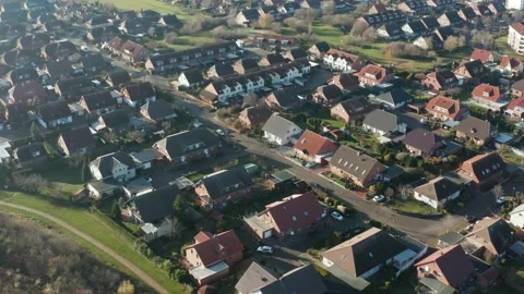 POV from flight over a monotonous settlement with single family houses Stock Footage 146725540