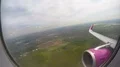POV of flight passenger looking through window at ground, sky and aircraft wing 4k or 4k+ Resolution