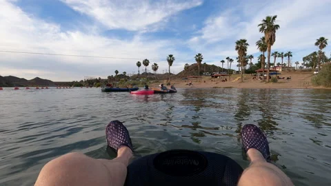 POV-Floating River view of legs and feet beach Stock Footage 136001708