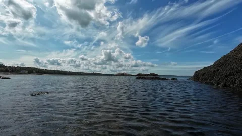 POV Floating Through Waves Along a Rocky Ocean Landscape Video stock 344766803