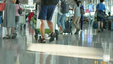 POV to the floor with crowded passenger inside airport terminal Stock Footage 147262798