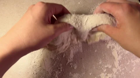 POV flouring paste in flour on kitchen table at home. Homemade bakery. Cooking Stock Footage 283477228