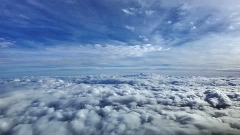 POV Flying Between Layers of Layers of Ethereal Stratus Clouds in a Blue Sky Stock Footage 328748521