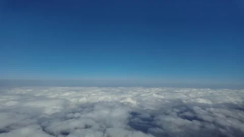 POV Flying at Hypersonic Speed Flying Over a Layer of Cottony Clouds Under a Stock Footage 313324979